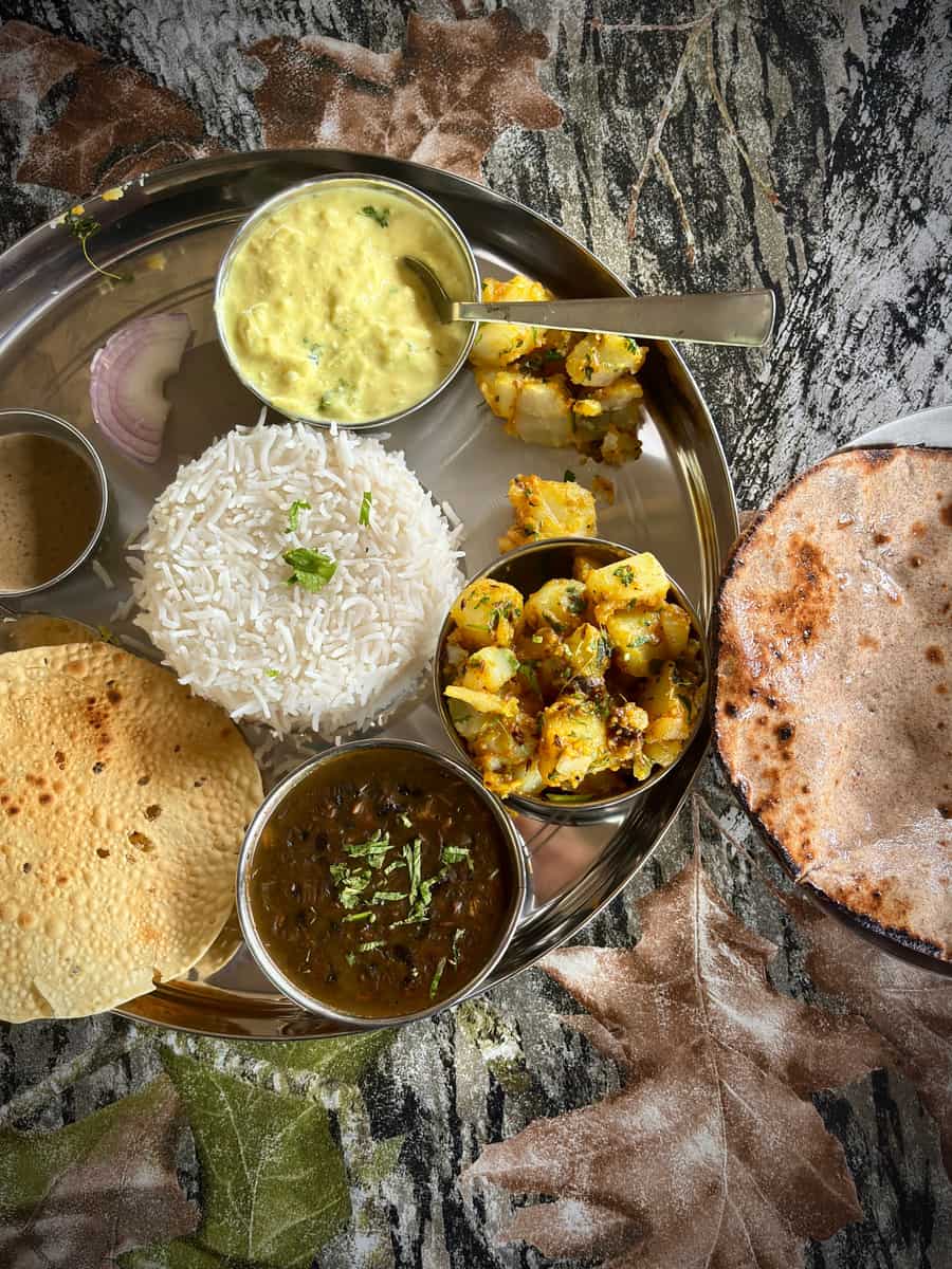 Dal, Jeera Rice, Seasonal Veg, Paneer Veg, Roti, Papad, Salad, Sweet