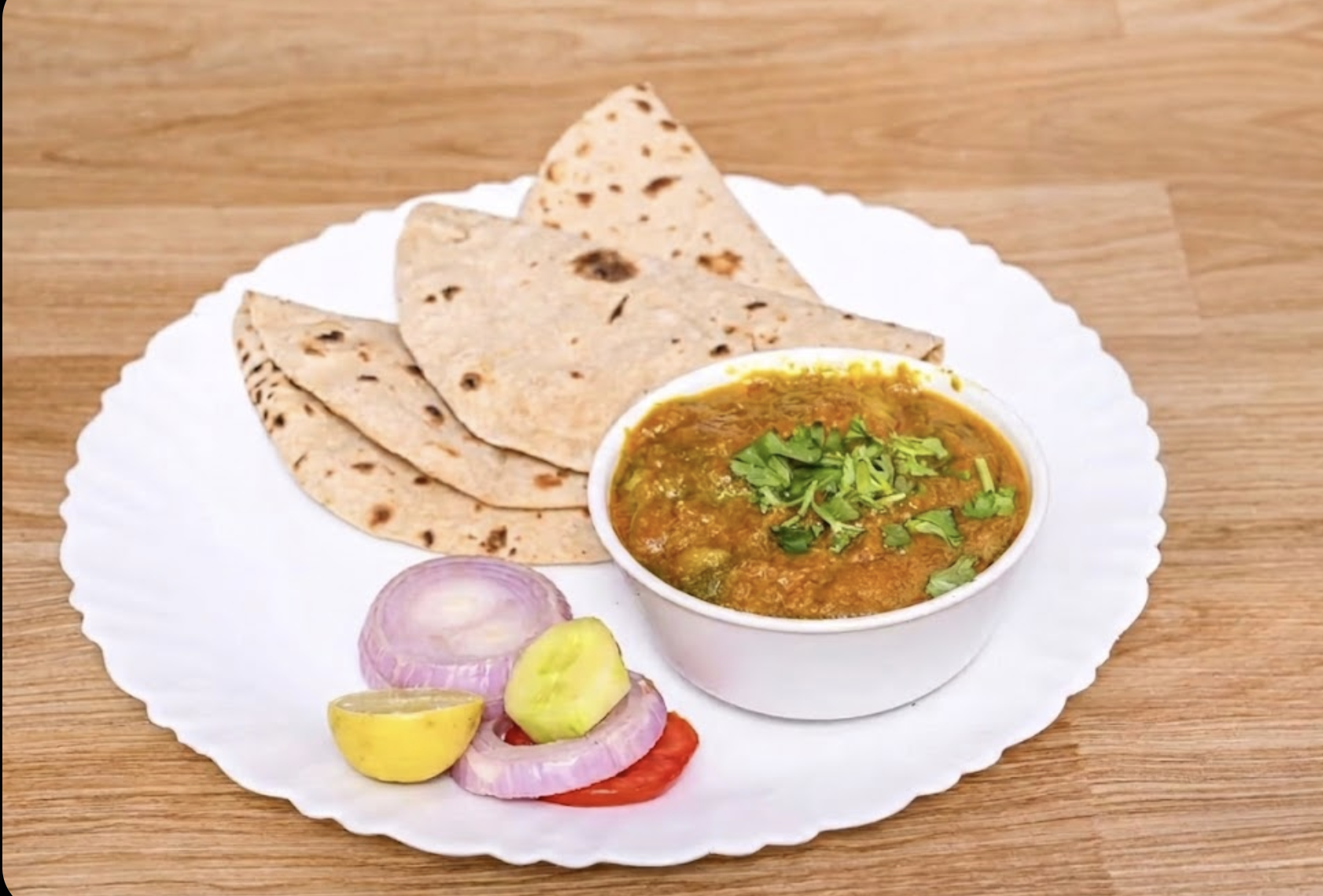 दाल + 5 तंदूरी रोटी ( butter) + सलाद