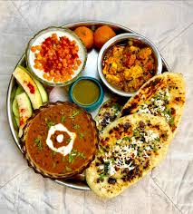 DAL FRY , MIX VEG , BUTTER PANEER MASALA , JEERA RICE , TAWA ROTI ( 5 PCS ) , GREEN SALAD, ROASTED PAPAD , GULAB JAMUN & BOONDI RAITA .