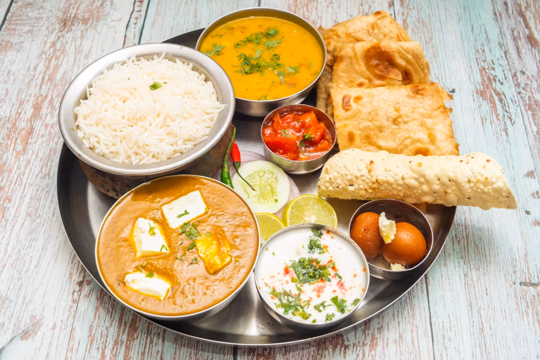 Thali (Jeera Rice, Dal Tadka, Paneer Sabji, Tawa Roti, Papad)