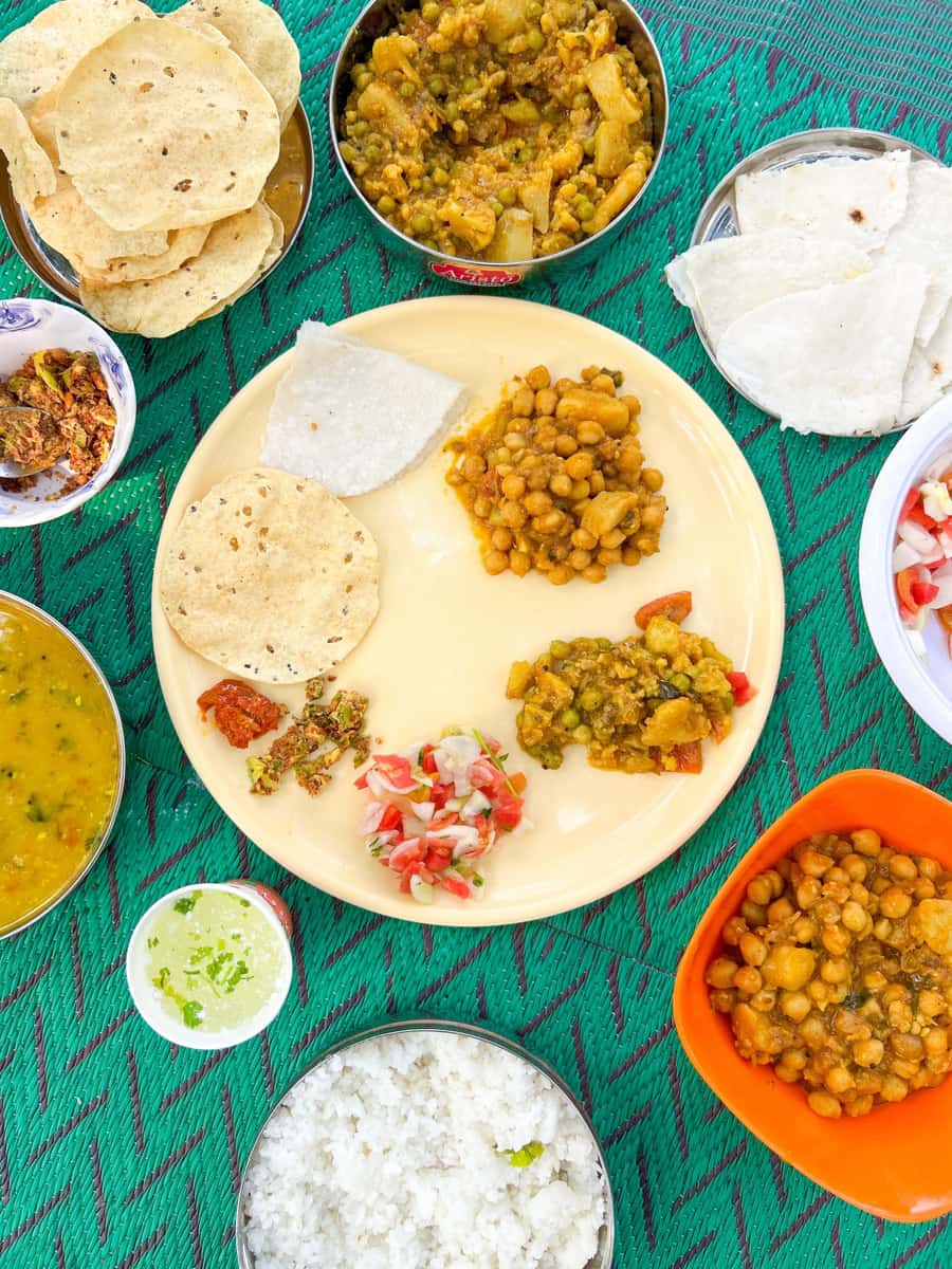 Thali (4 Roti, Dal, Rice, Seasonal Veg., Salad)